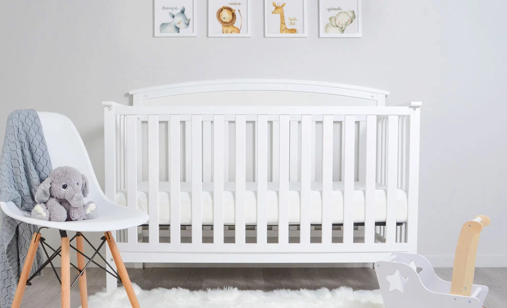 the milliard crib mattress in a crib