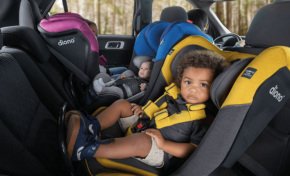 assortment of diono radian 3qxt car seats installed three in a row with front and rear facing configurations