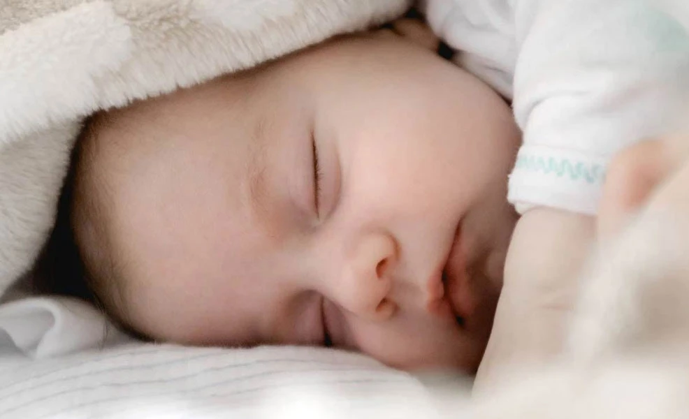 baby in unsafe sleeping conditions
