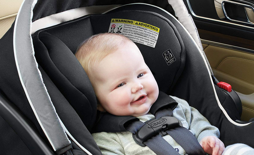 baby in graco snugride car seat