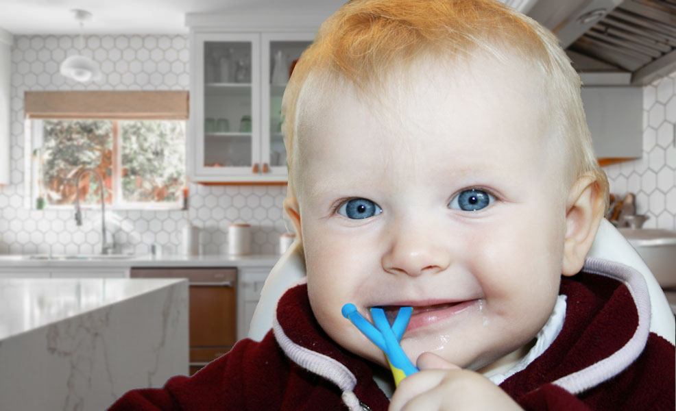 baby chewing on a teething toy