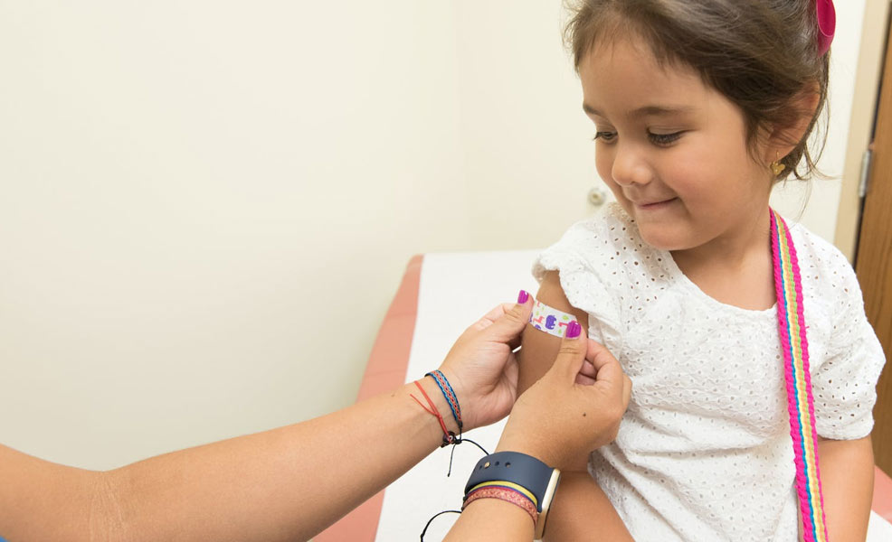 child getting vaccine