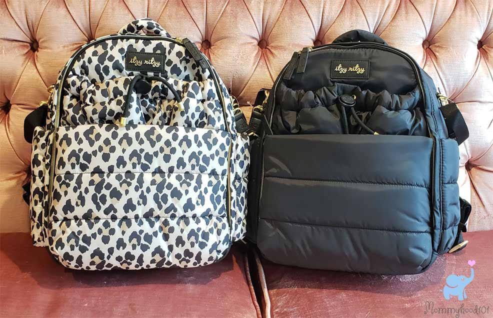 itzy ritzy dream backpack diaper bags on the couch