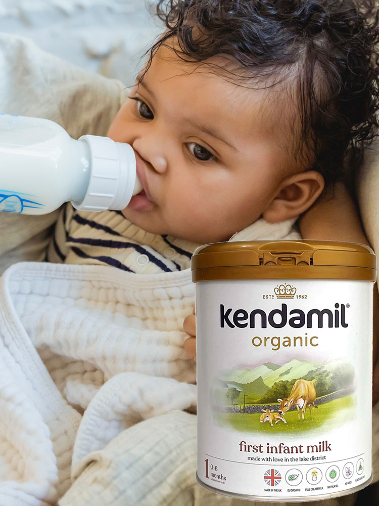 baby drinking kendamil organic baby formula from a dr browns bottle