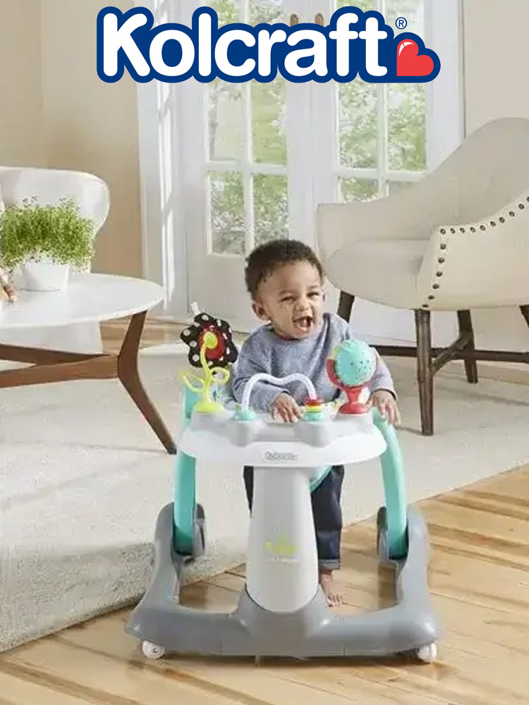 a toddler boy in the kolcraft tiny steps 2 in 1 baby activity walker