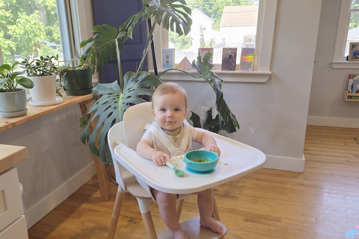 a child sitting in the lalo high chair ii 2 during our review
