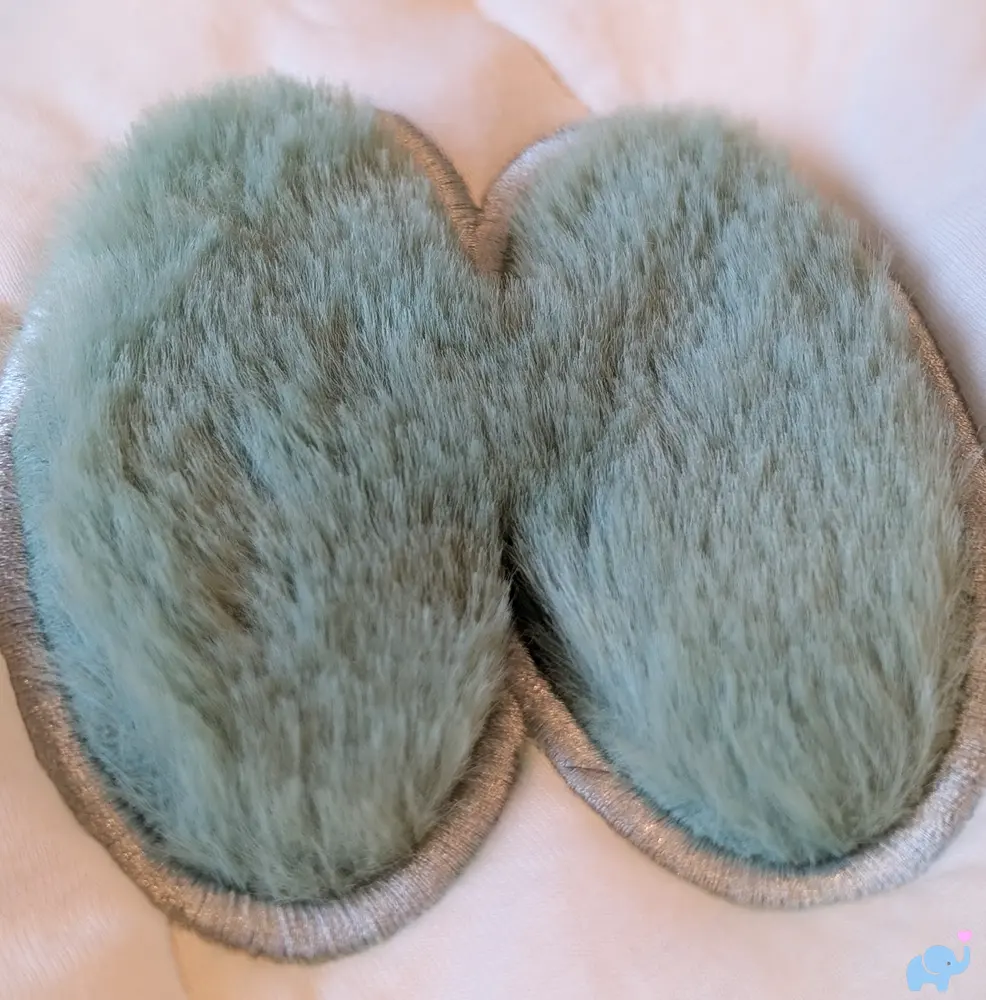 Green fuzzy bunny ears sensory feature on the Lalo Play Gym II mat