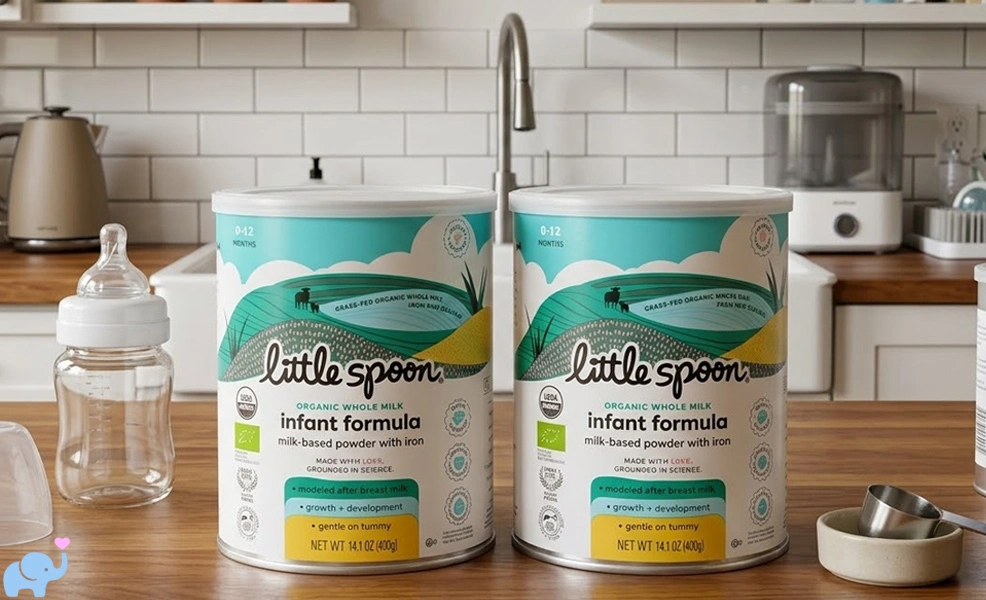 two tins of little spoon baby formula on a kitchen counter