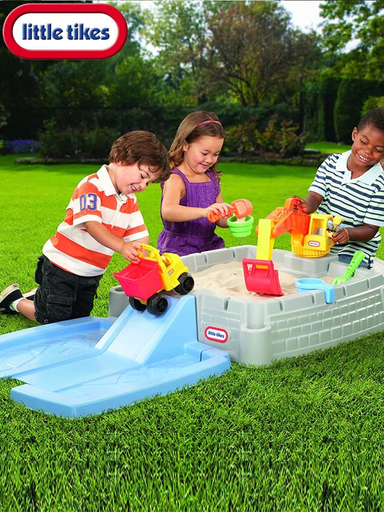 kids playing together in a sand table