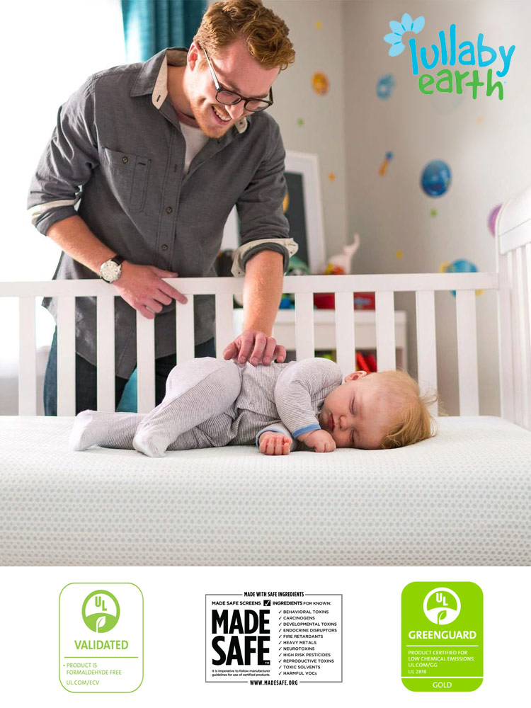 lullaby earth breeze crib mattress with sleeping baby and father looking inside