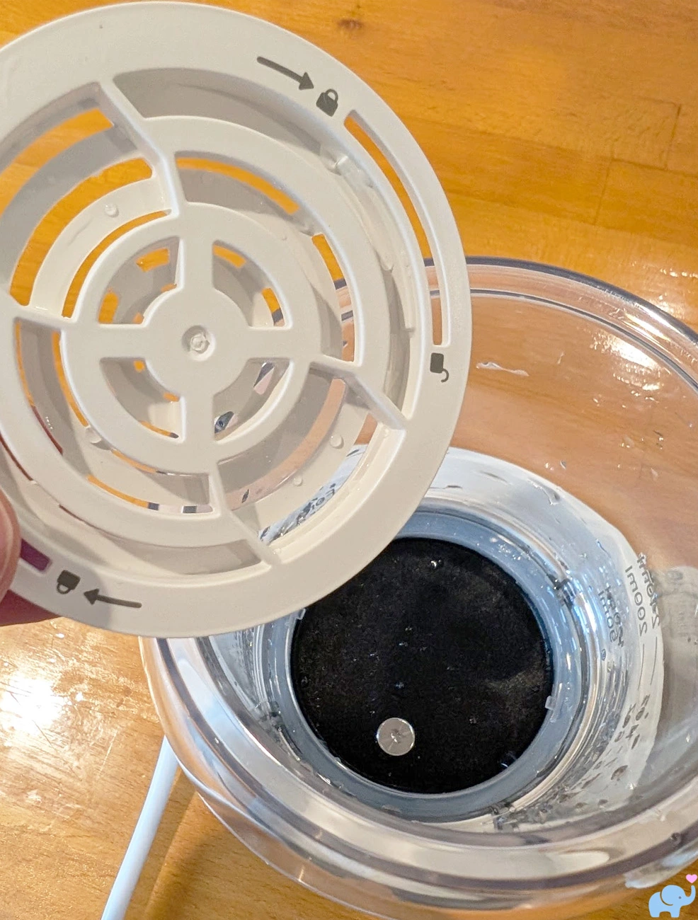 bottom plastic vent plate for the Momcozy NightPro Baby Bottle Warmer before installation