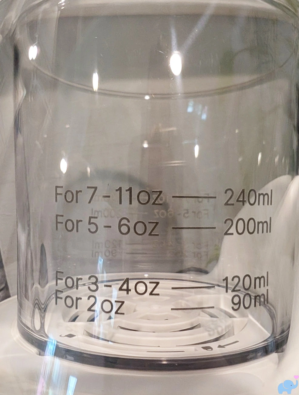 graduated water markings on the clear Momcozy NightPro bottle warmer reservoir