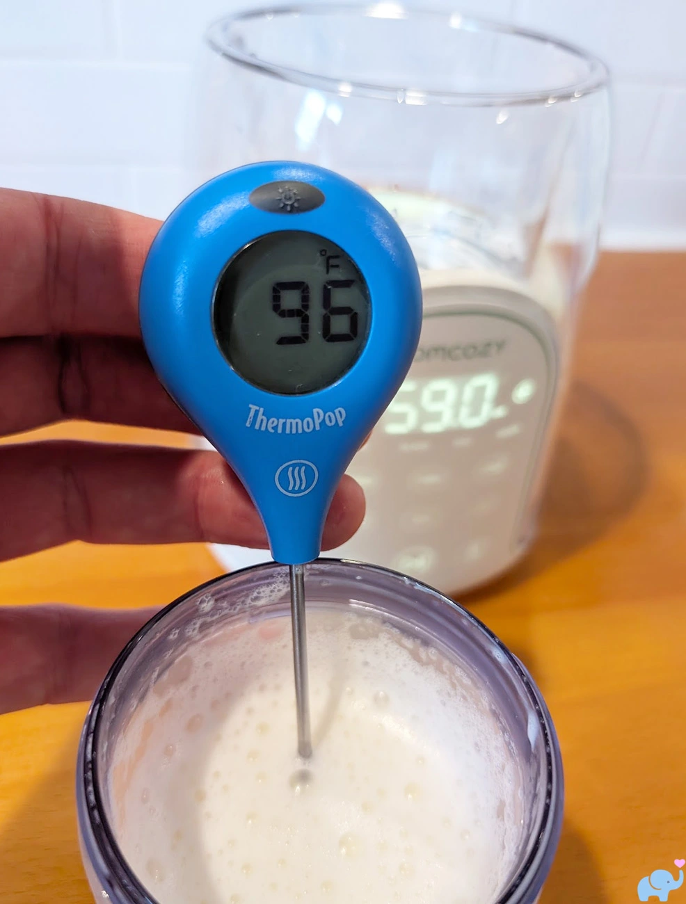 Comotomo silicone baby bottle warmed to 96 degrees in the Momcozy NightPro Bottle Warmer