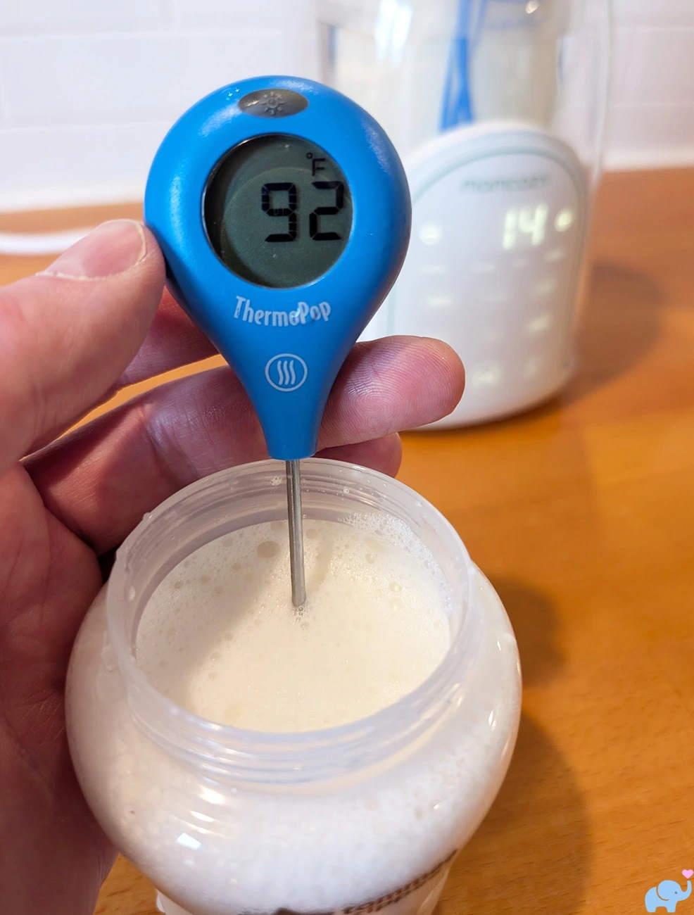 Tommee Tippee plastic baby bottle warmed to 92 degrees in the Momcozy NightPro Bottle Warmer