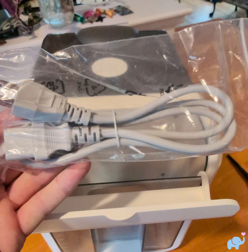 Standard three prong power cord included with the Momcozy DeepClean Baby Bottle Washer D8