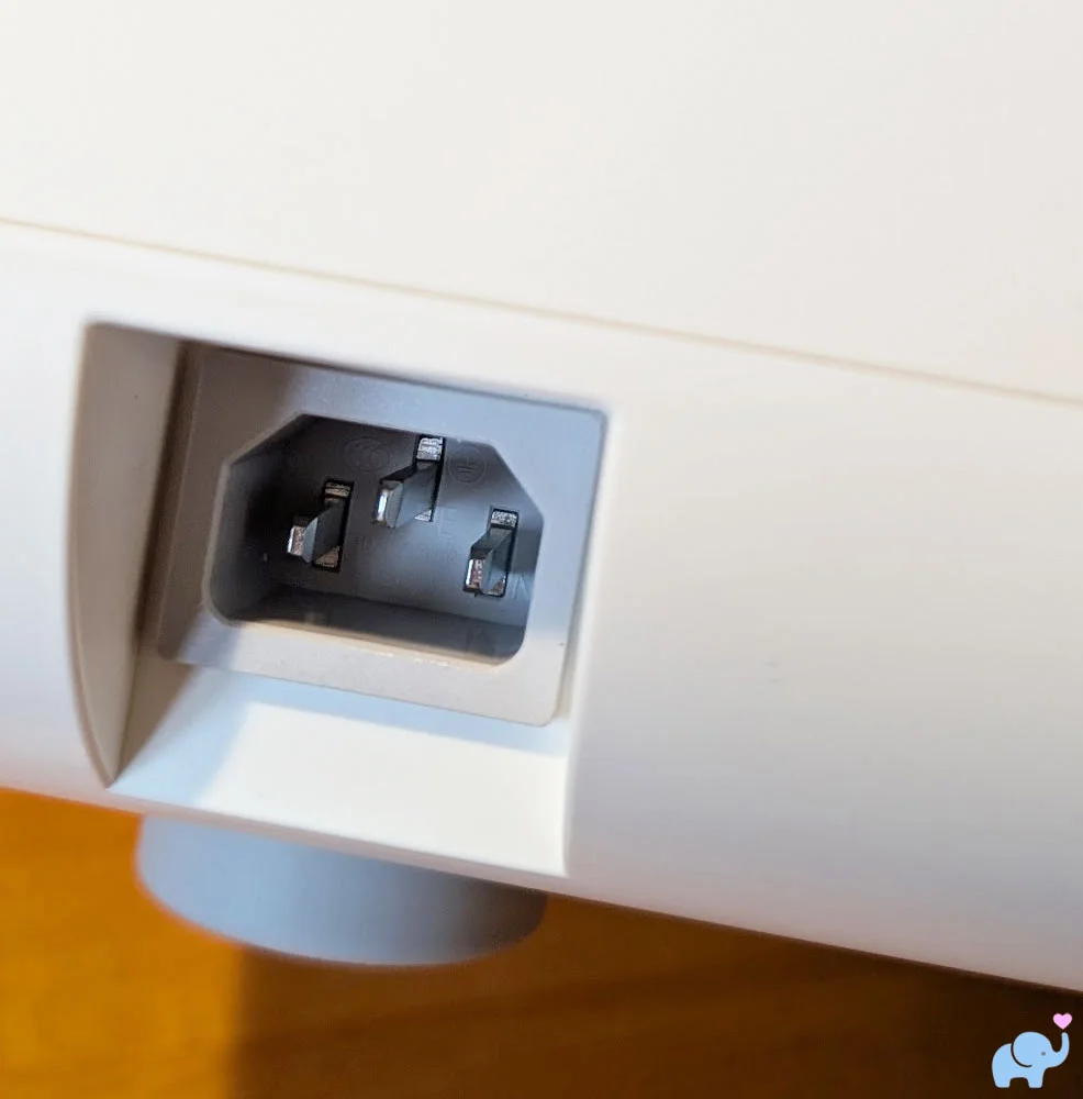 Close up of the power port on the back of the Momcozy DeepClean Baby Bottle Washer D8