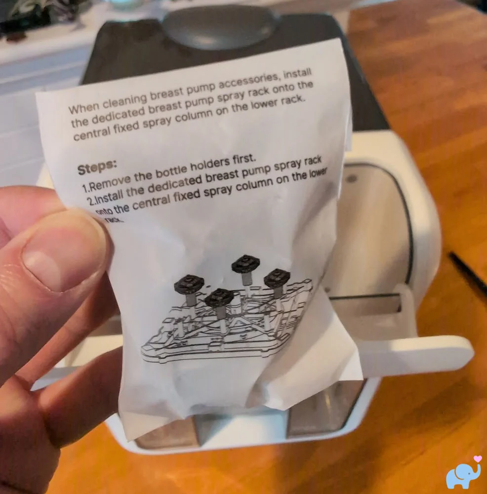 Breast pump accessory holders included with the Momcozy DeepClean Baby Bottle Washer D8