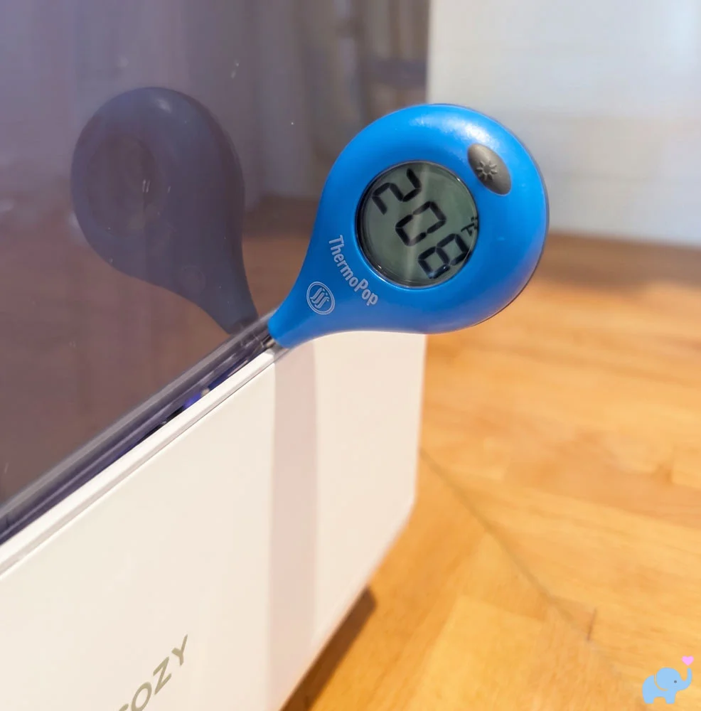 Digital thermometer measuring steam sterilization temperature in the Momcozy DeepClean Baby Bottle Washer D8