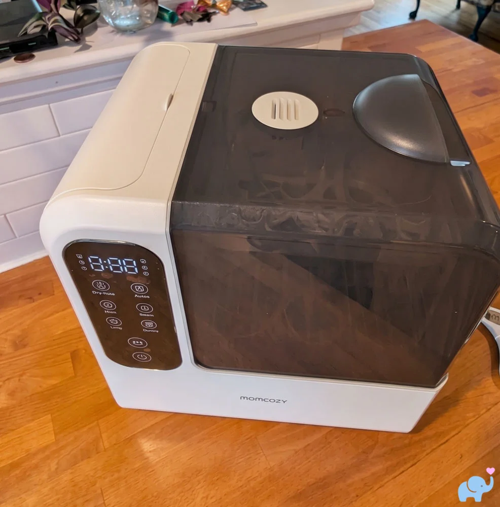 Momcozy DeepClean Baby Bottle Washer D8 unpackaged on the kitchen counter before setup