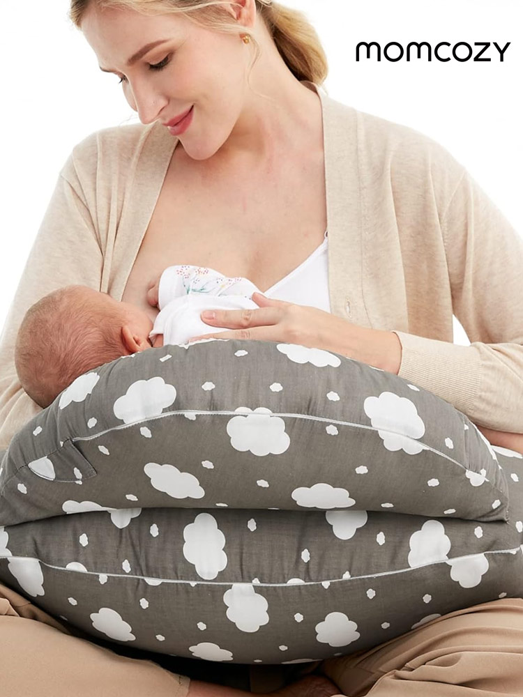 a woman breastfeeding her child with the momcozy nursing Pillow