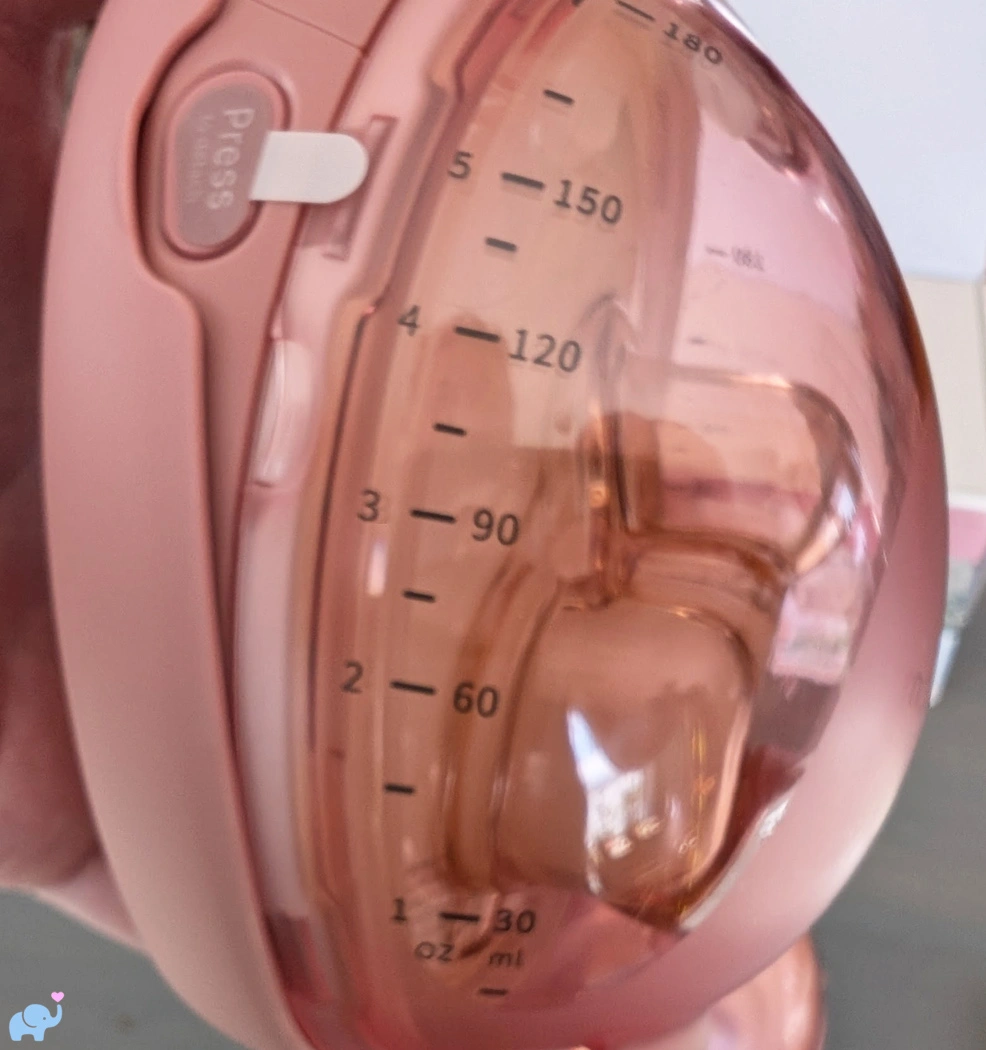 graduated milk volume markings on the Momcozy Wellness 1 breast pump collection cup