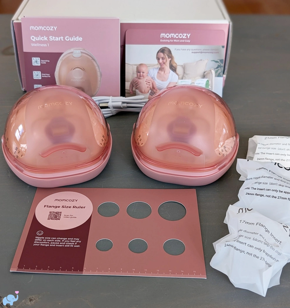 Momcozy Wellness 1 breast pump unboxed showing the pumps flange sizes nipple ruler guide and charging cords