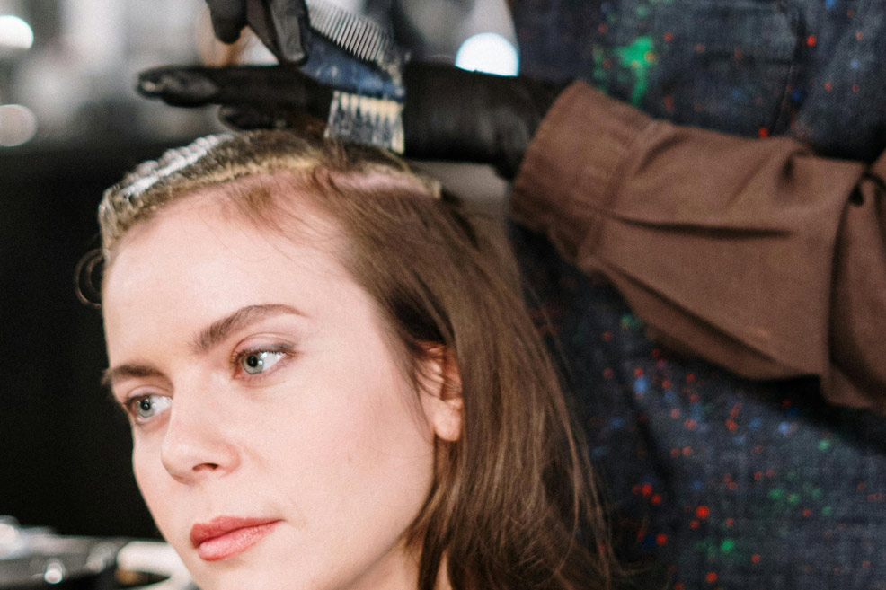 woman getting her hair dyed