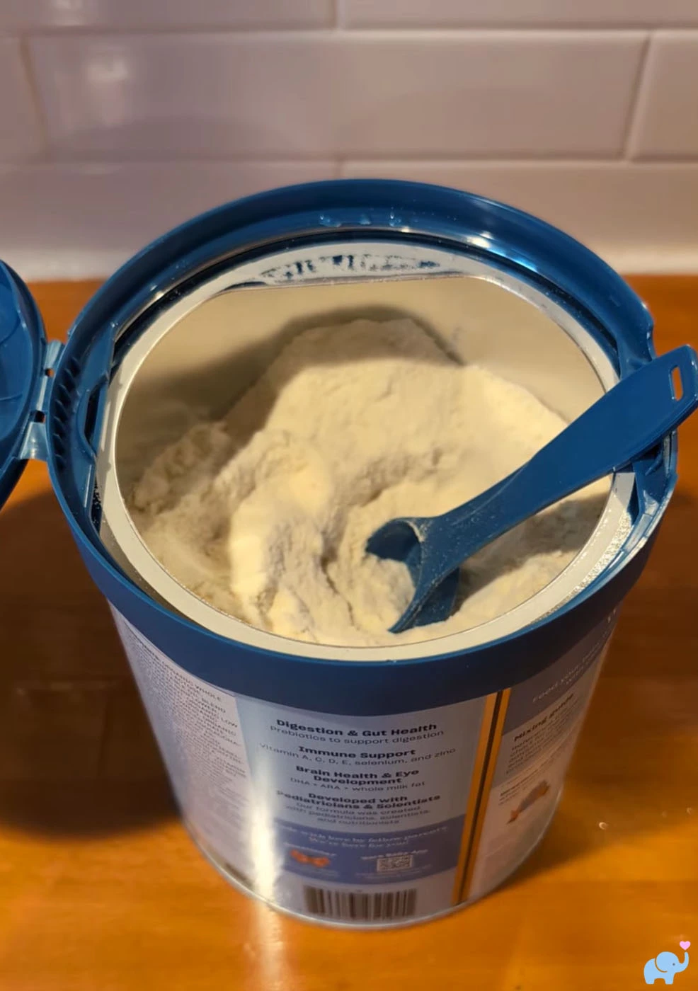 Nara Organics formula scooper scooping powder from the can
