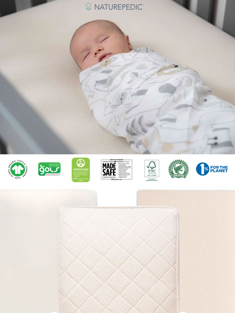 the naturepedic crib mattress with a sleeping baby laying on top with features listed