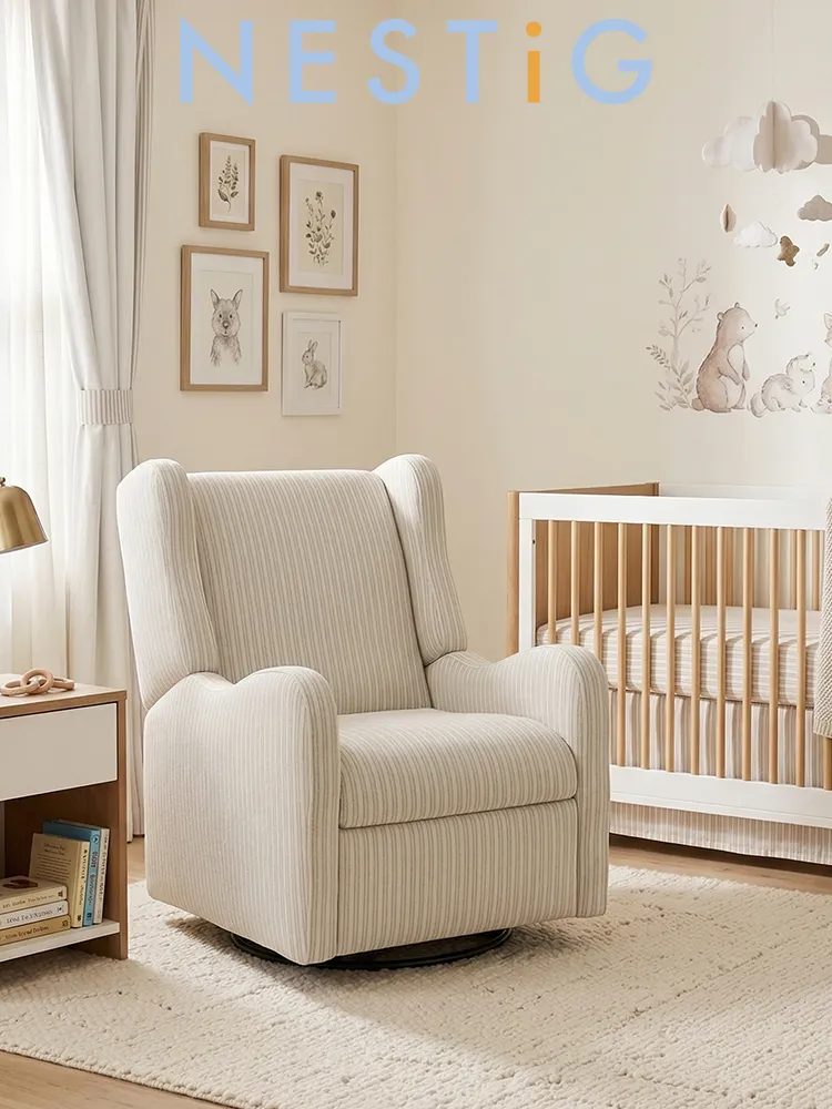 the Nestig Drift glider in Pebble Stripe fabric in a baby nursery