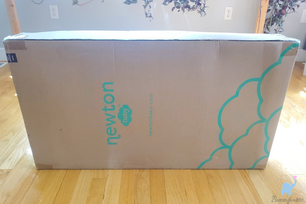 the newton bassinet when it arrived in a large cardboard box