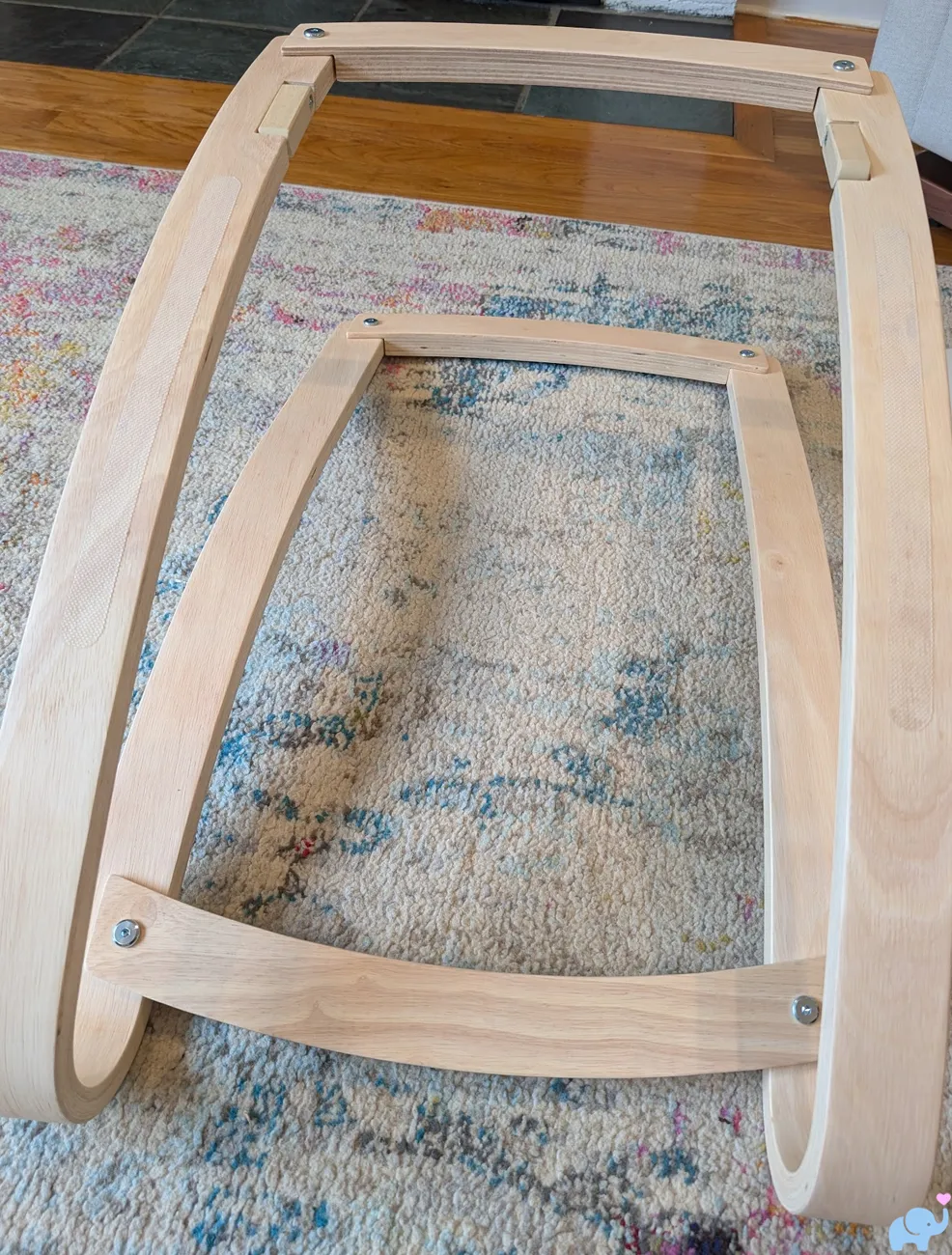 Newton Baby Rocker frame assembly with lateral braces and bow shaped wooden rocker legs