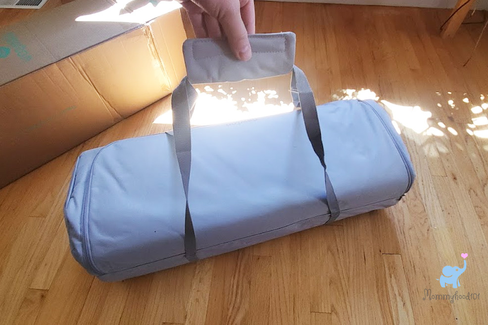 the newton travel crib in its carry bag