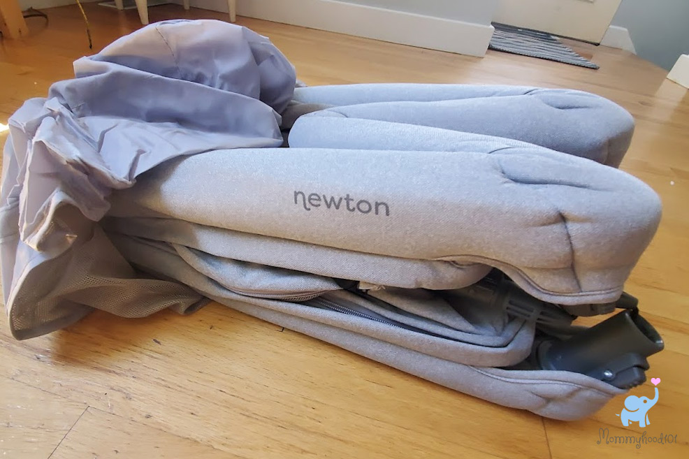 newton travel crib folded up