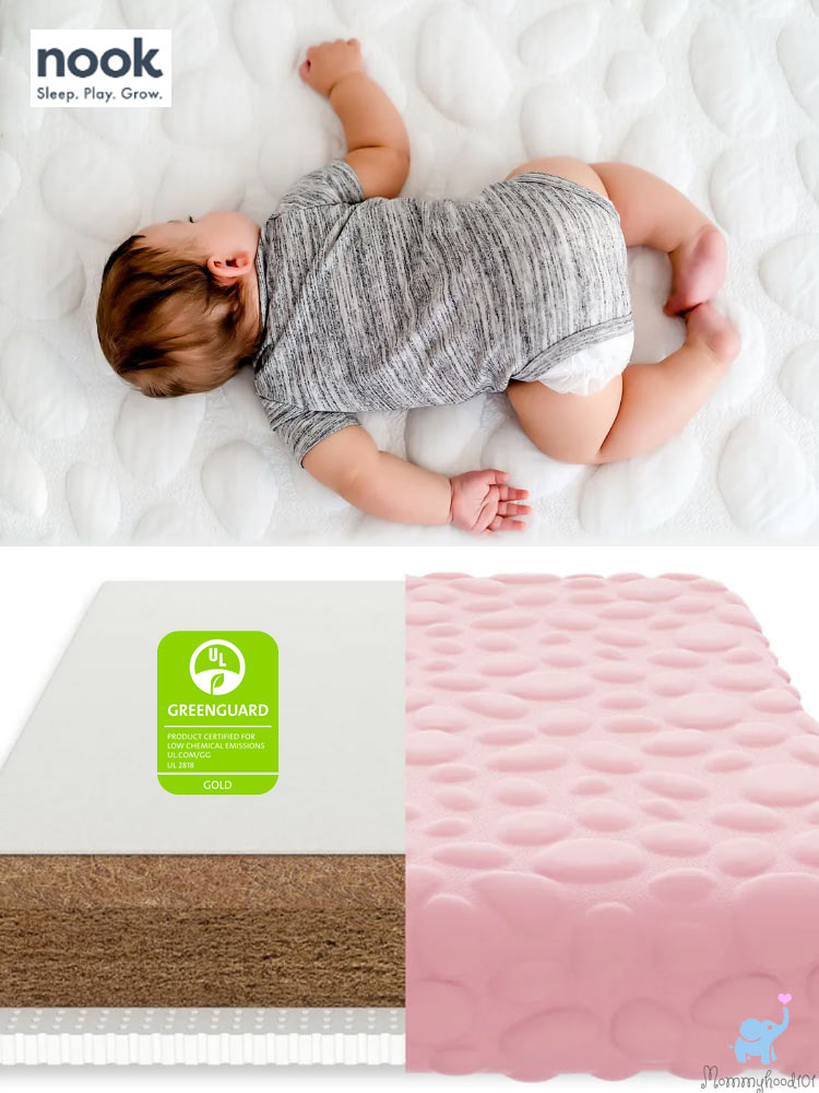nook pure organic crib mattress with sleeping baby and cut open cross section of mattress
