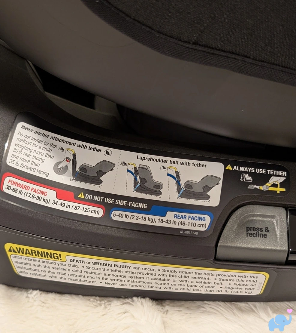 nuna revv maxx installation label with weight and height limits