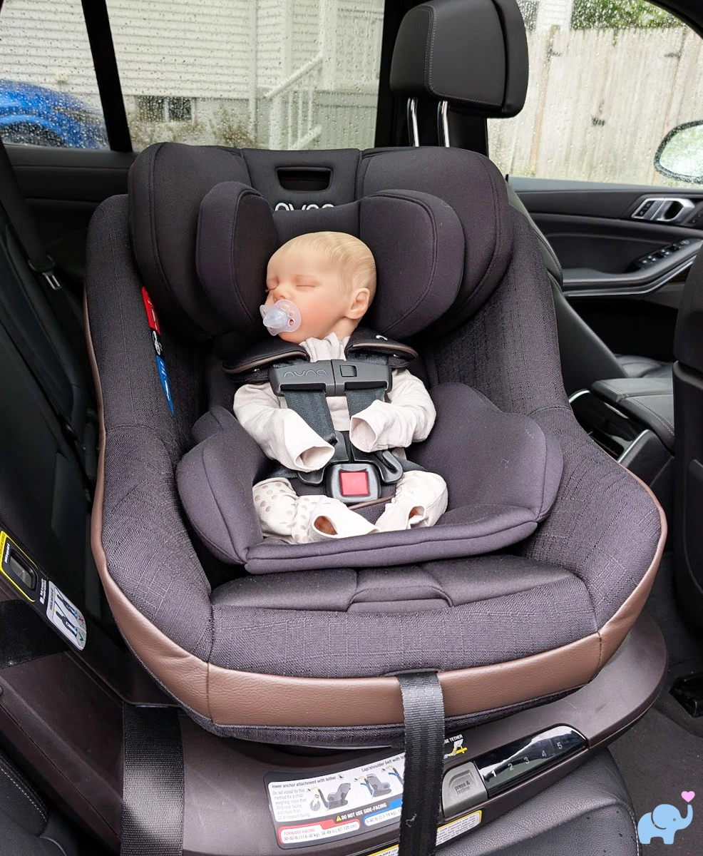 nuna revv maxx installed and rotated sideways for access to baby