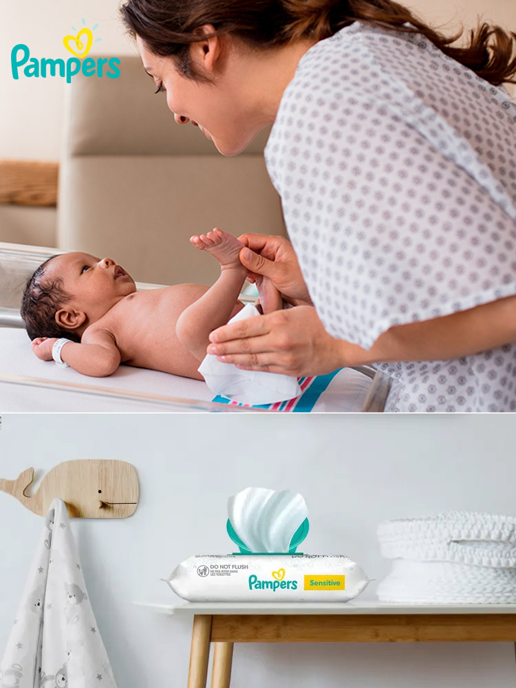 a mom doing a diaper change with pampers baby wipes and a package of the wipes on a nursery dresser