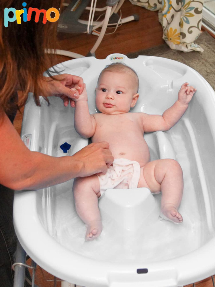 a mother bathing a baby in the primo eurobath bathtub