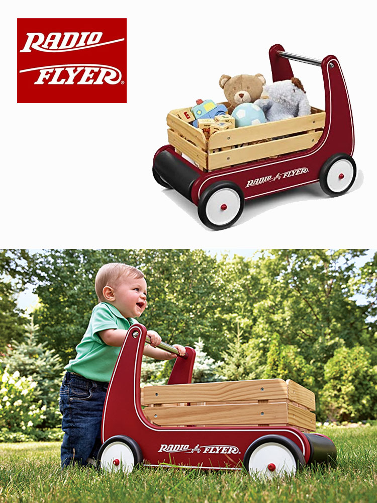 a baby pushing the radio flyer classic walker wagon and another wagon filled with toys