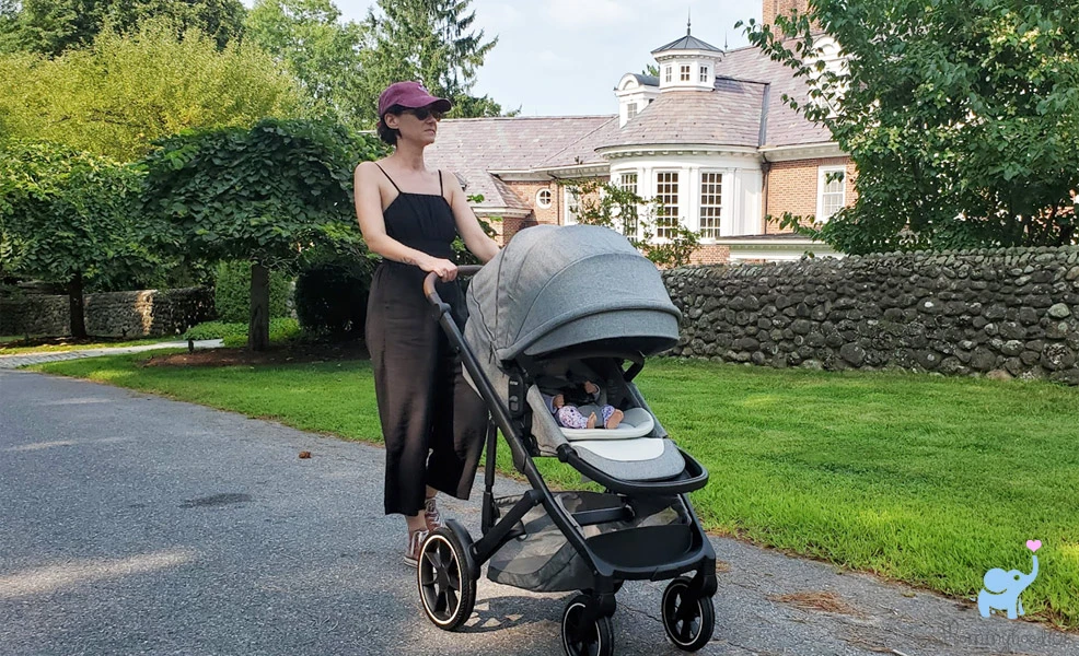 mom pushing the romer tura stroller