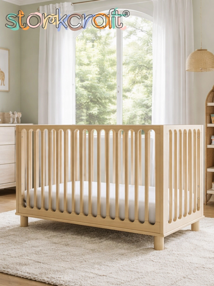 the storkcraft sicily crib in a nursery with window in background