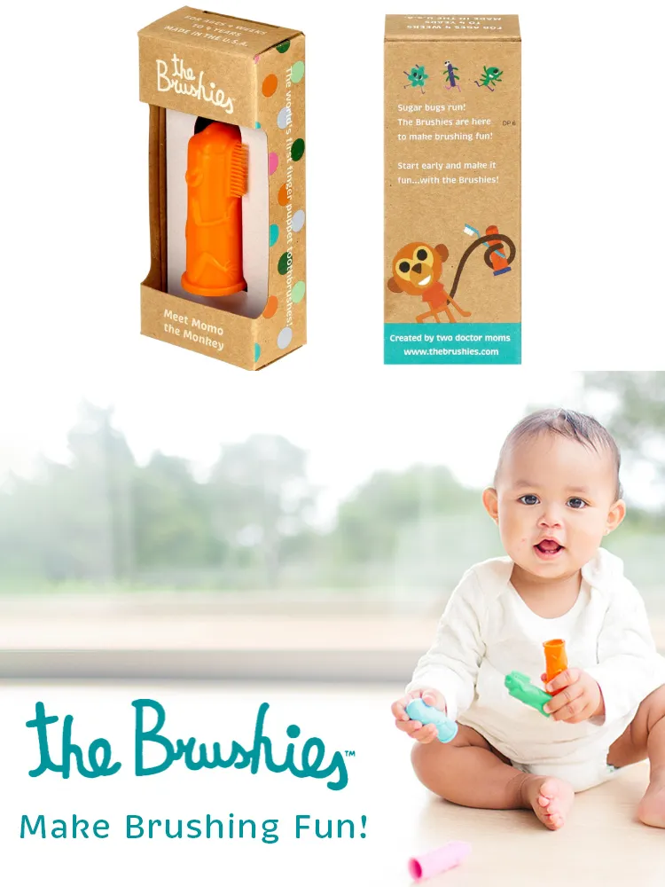 The Brushies Finger Toothbrush worn on a parent's finger