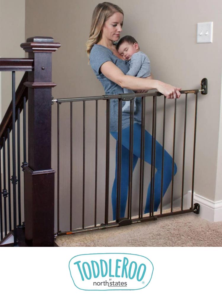 Toddleroo North States Baby Gate with mom holding baby on stairs