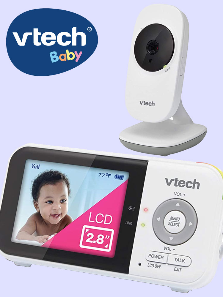 vtech vm819 baby monitor with a smiling baby on the video image