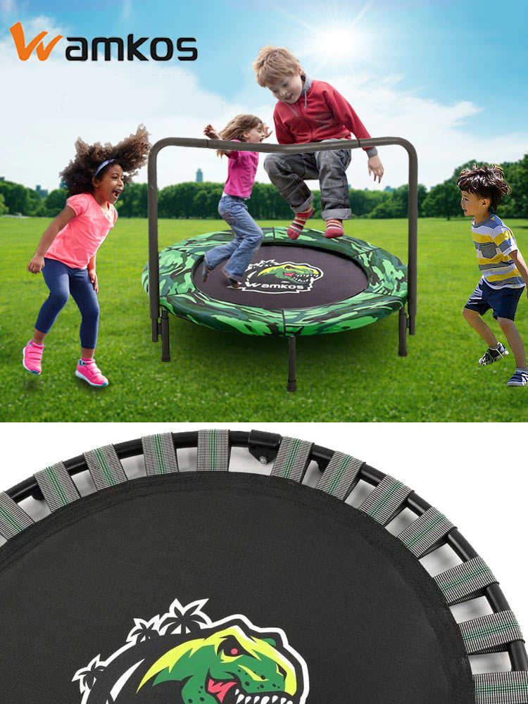 kids playing and jumping on the wamis dinosaur mini trampoline in a backyard