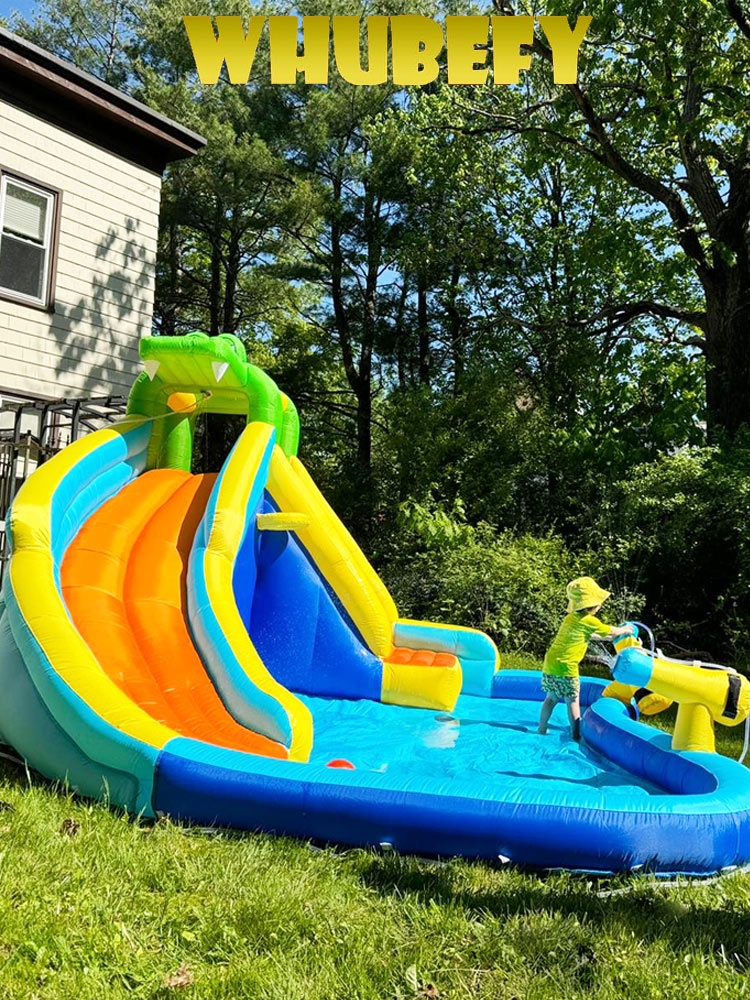 toddler playing on the whubefy inflatable water slide