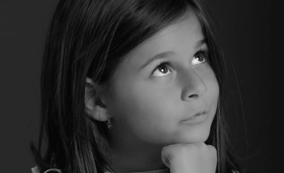 child thinking about would you rather questions